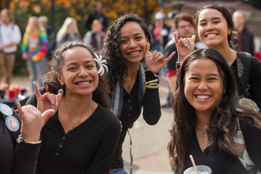 students from EWU's Hawaiian club smiling outside